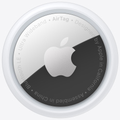 Apple AirTag - a small roung object with one white plastic side and one metal back with an etched Apple logo.