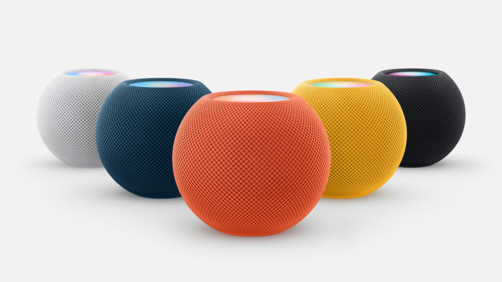 HomePod Mini's in White, Navy, Orange, Yellow and Midnight.